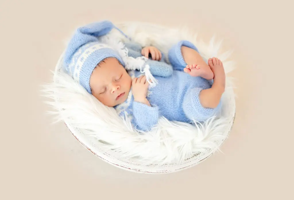 Beautiful newborn in cradle