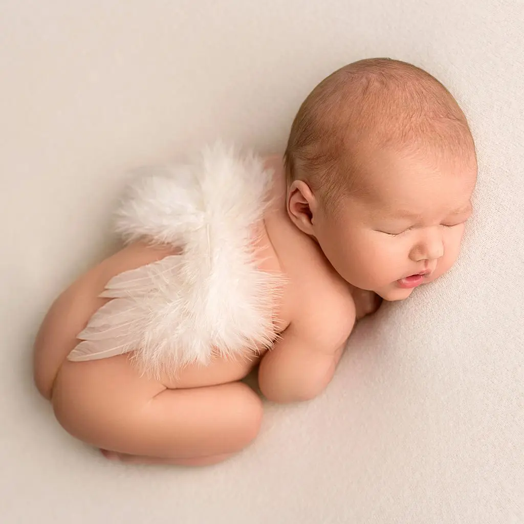 45+ Baby Names That Mean Wings 3 top view of a newborn baby sleeping naked angel wi 2023 06 05 23 40 08 utc