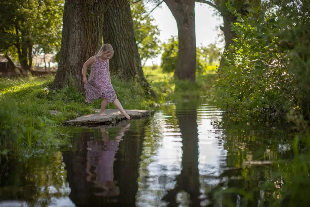 Cute girl among trees
