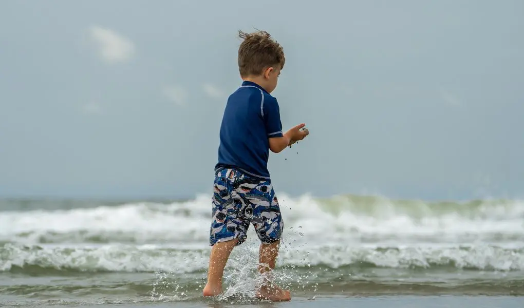 200 Place Inspired Boy Names That Are Unique and Exotic 1 Boy playing on beach