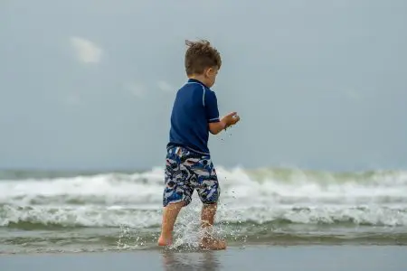 Boy playing on beach