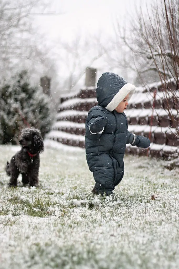 Child playing outside in snow