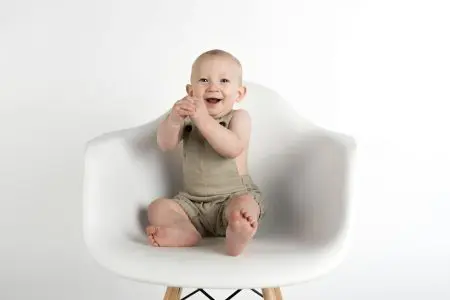 Unique and Powerful German Boy Names 1 Baby Sitting on White Chair