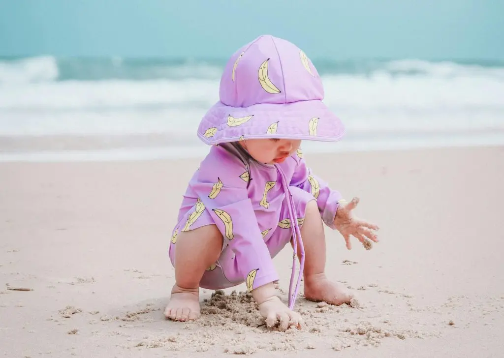 Baby Girl Playing on Sand on Beach