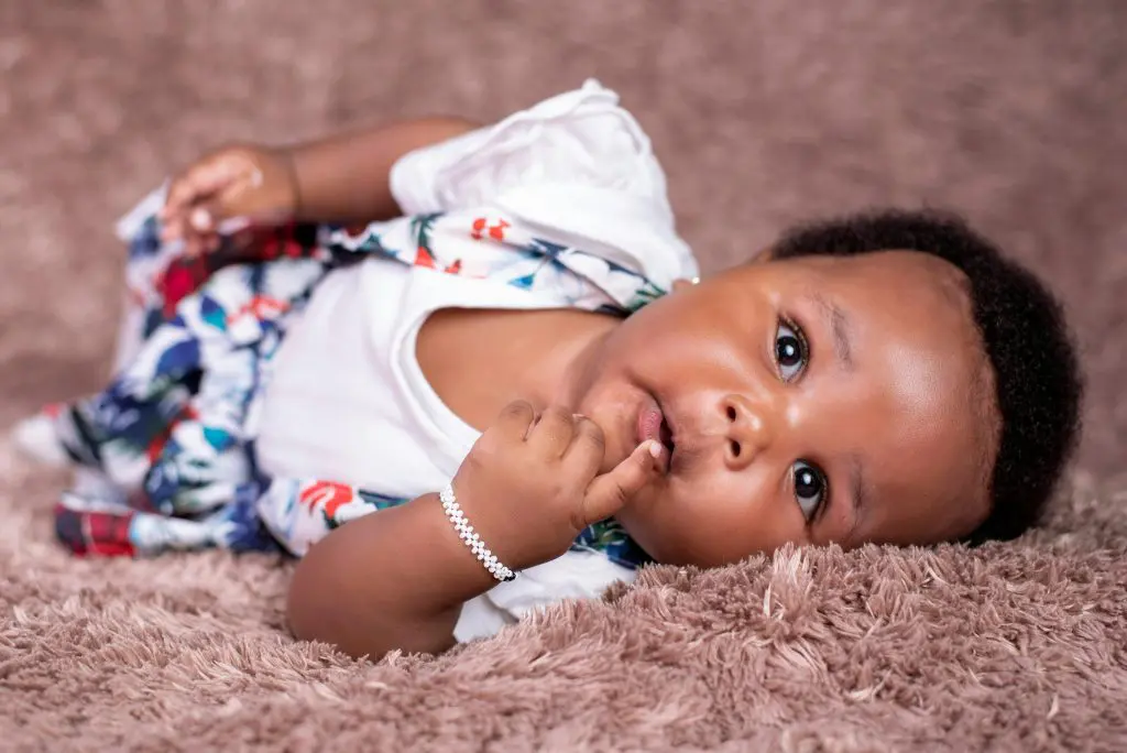 Unique Girl Names That Start With A 11 Little baby lying on blanket