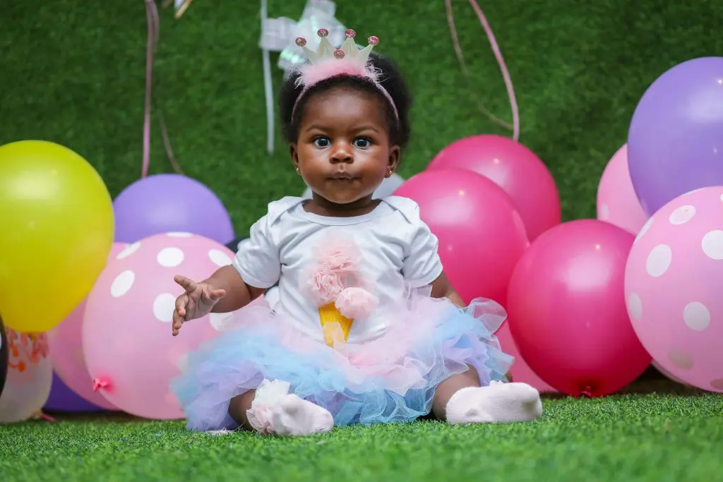 Unique Girl Names That Start With A 17 Toddler On A White Dress With Balloons