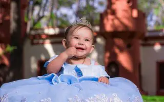 Baby Girl Wearing a Gown - Featured