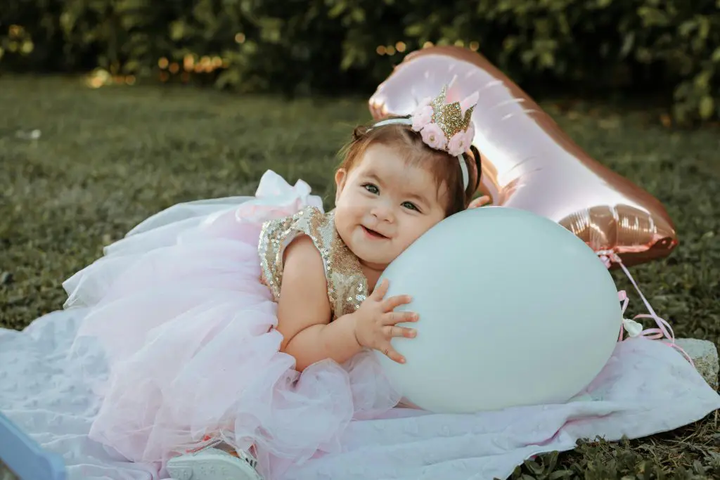 A Baby Girl Wearing a Gown