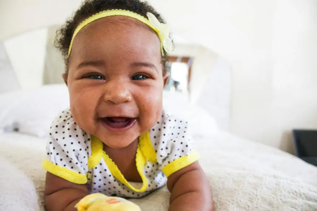100+ Unique Girl Names That Start With G 7 Baby Wearing White And Yellow Shirt