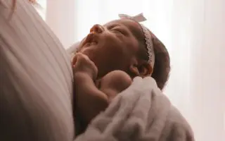 Mother Carrying Baby