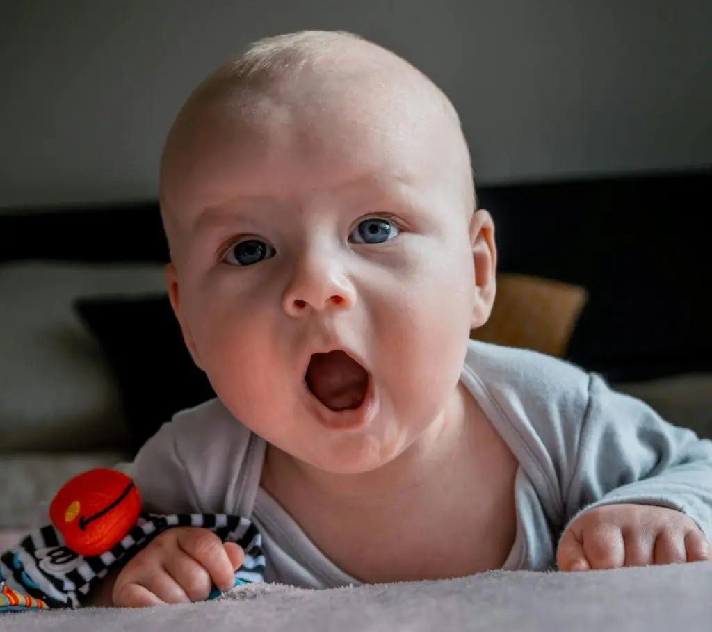 500 Stunning Four Letter Baby Boy Names 11 Baby Lying on the Bed