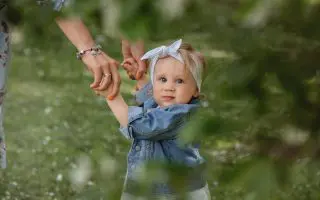 Cute Baby with Her Parent - Featured