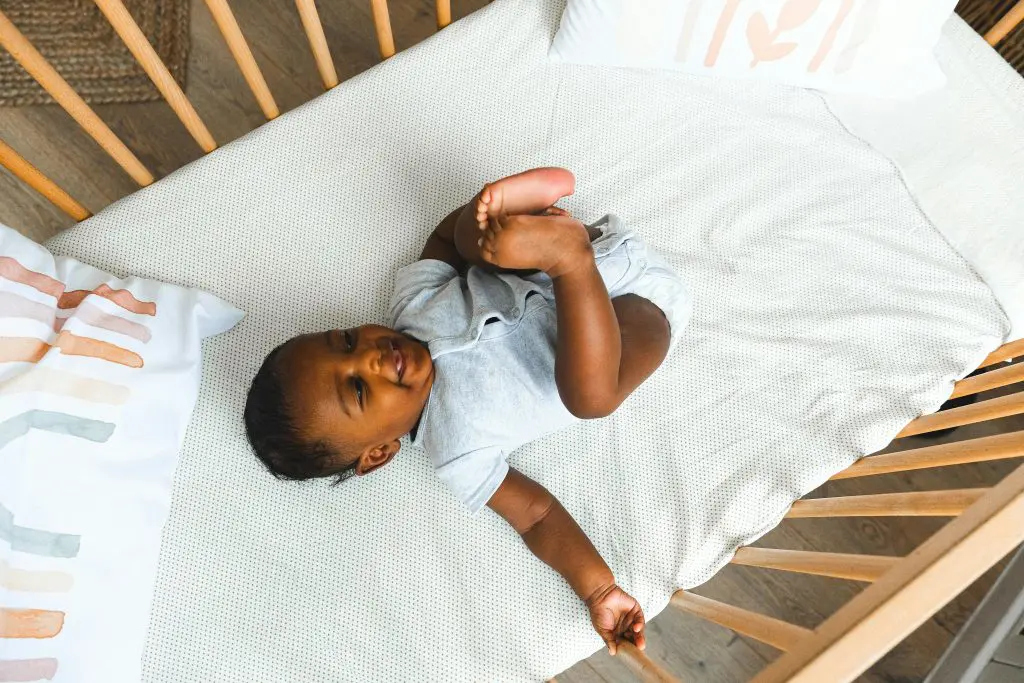 100 Romantic Boy Names That Will Steal Your Heart 11 Baby in a Crib - Featured