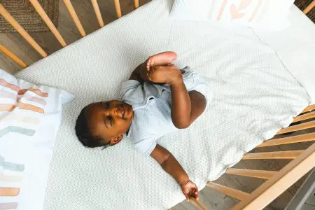 Baby in a Crib - Featured