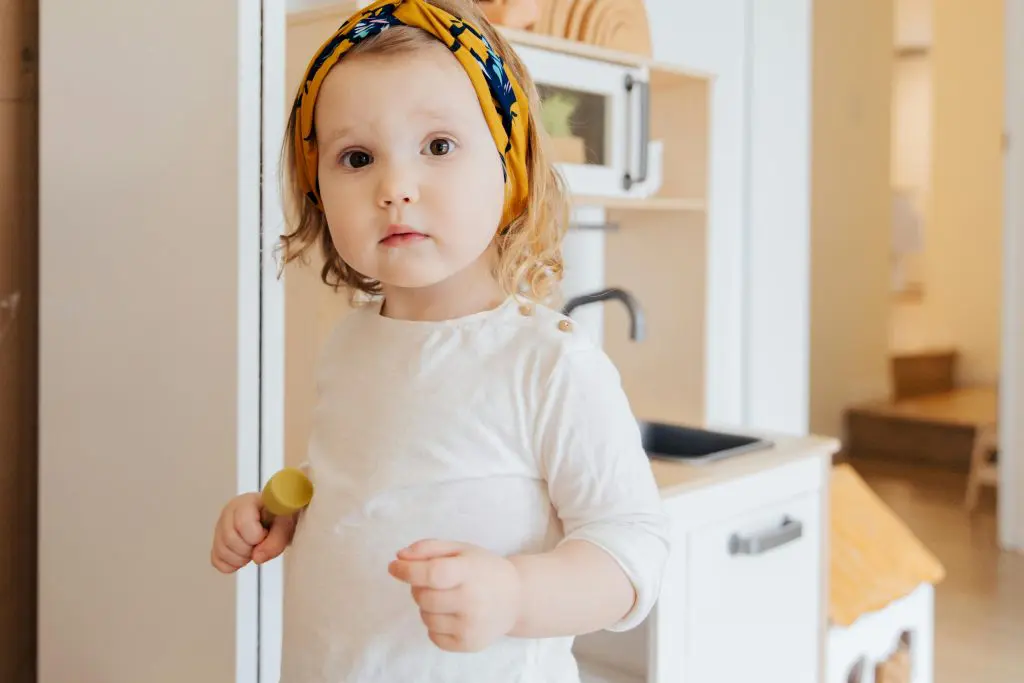Unique Girl Names That Start With A 12 Girl in White Long Sleeve Shirt Holding Yellow Plastic Toy