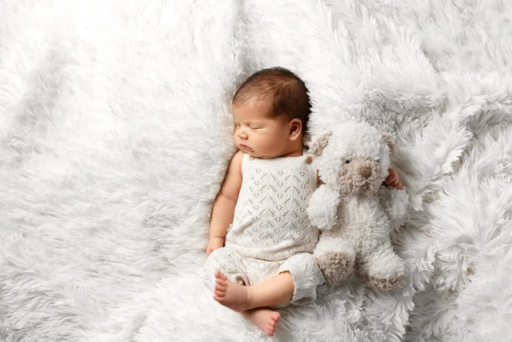 300+ Unusual Boy Names for Your Little Trailblazer 3 Adorable Newborn Baby Sleeping with Teddy Bear