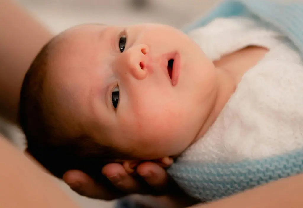 500 Stunning Four Letter Baby Boy Names 8 Hand Holding Baby Face