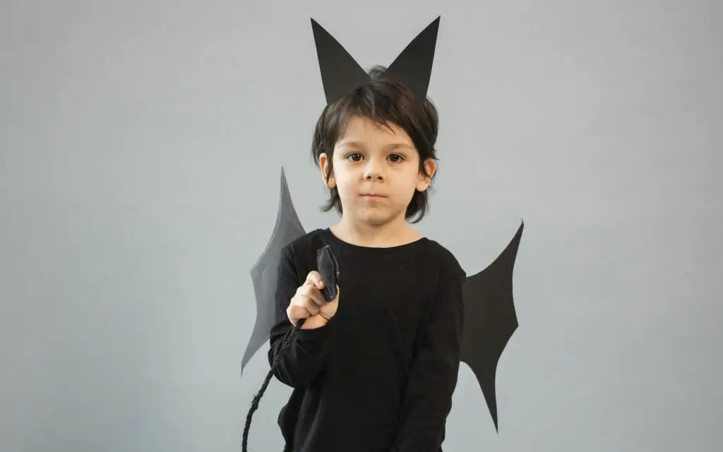 250+ Timeless & Unique Mythological Boy Names 11 Cute boy in black bat costume