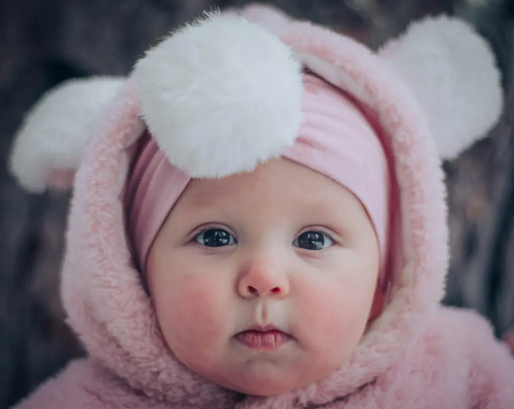 300 Unusual Girl Names that are Beautiful and Meaningful 3 Baby in Pink Hoodie