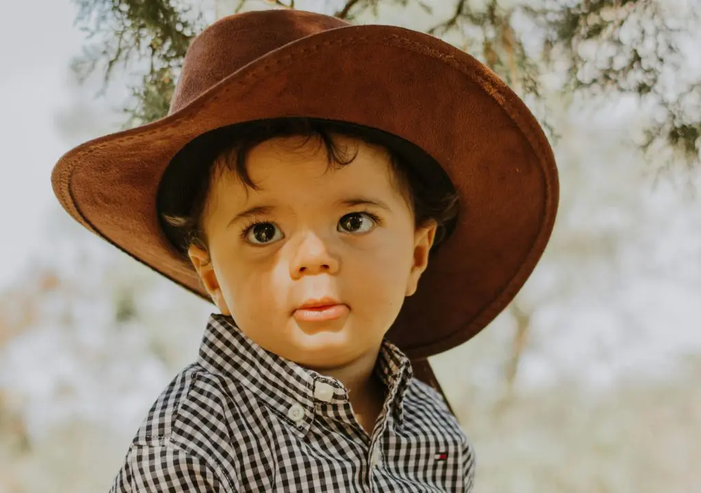 350 Handsome Southern Boy Names 9 Adorable Baby in Cowboy Hat Outdoors