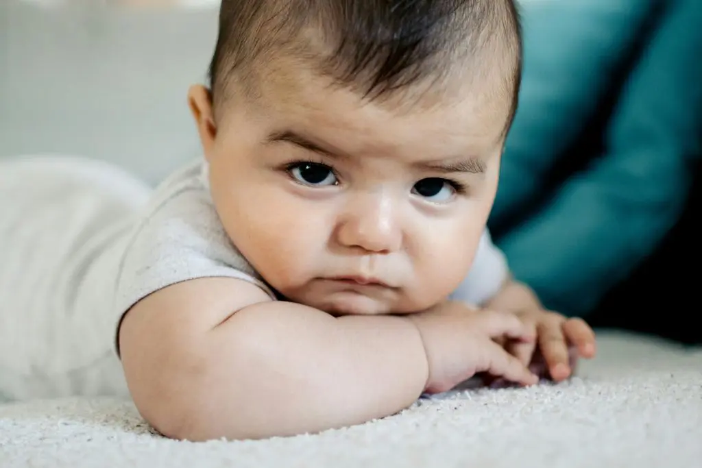 100 Unique Boy Names That Start With S 8 Cute Baby Lying on White Textile