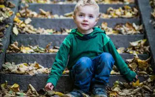 Boy Sitting On Stairs - Featured