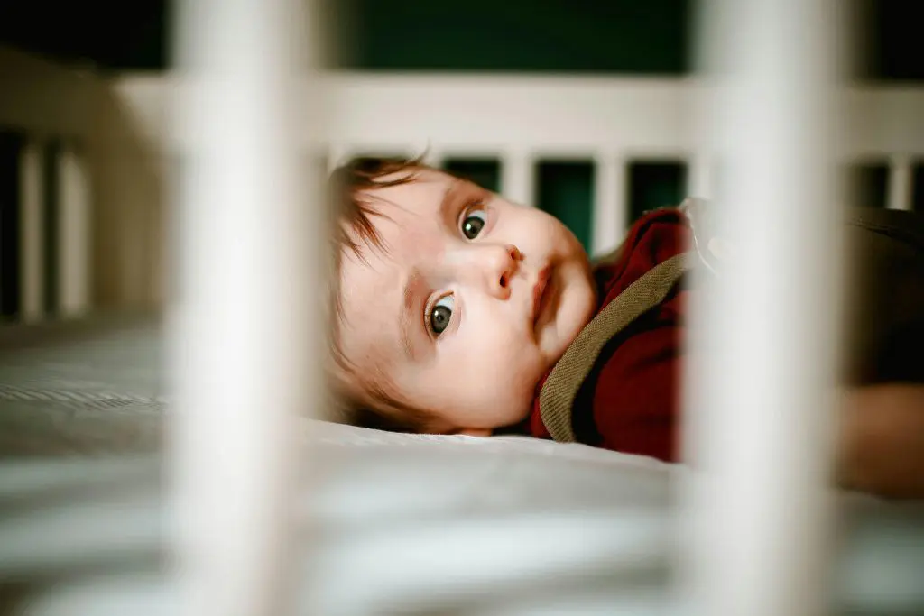 300 Unusual Girl Names that are Beautiful and Meaningful 5 Calm baby lying in crib at home