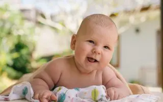 An Adorable Baby Smiling - Featured