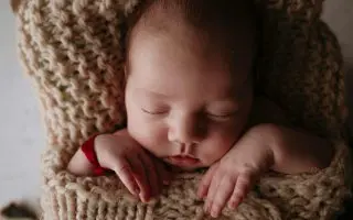 Peaceful Sleeping Baby in Cozy Blanket - Featured