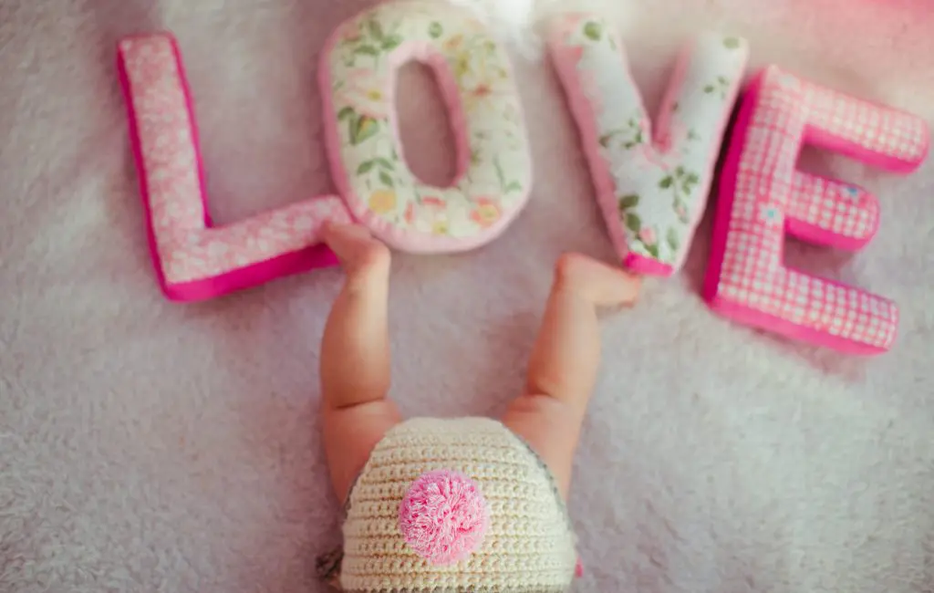 Toddlers legs and decorative fabric letters