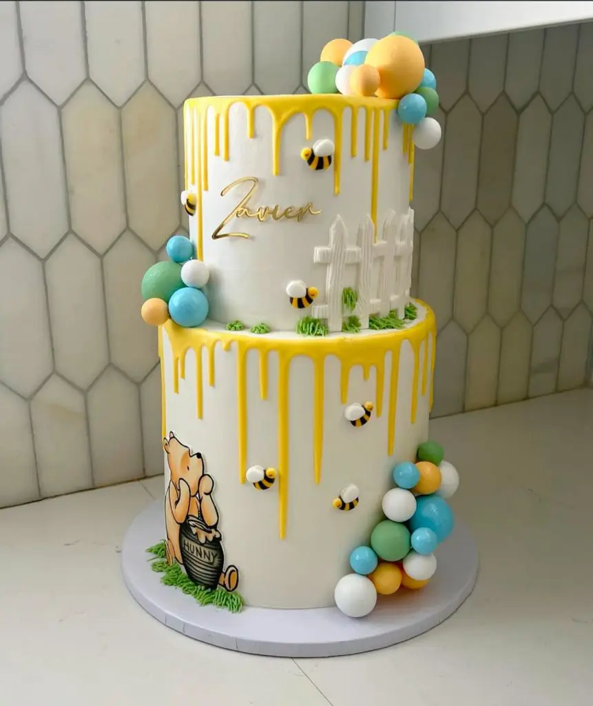 Two-tiered cake for Winnie The Pooh Baby Shower