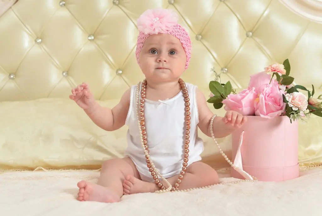 80 Gemstone Girl Names For Your Little Jewel 7 Cute little baby girl wearing necklace