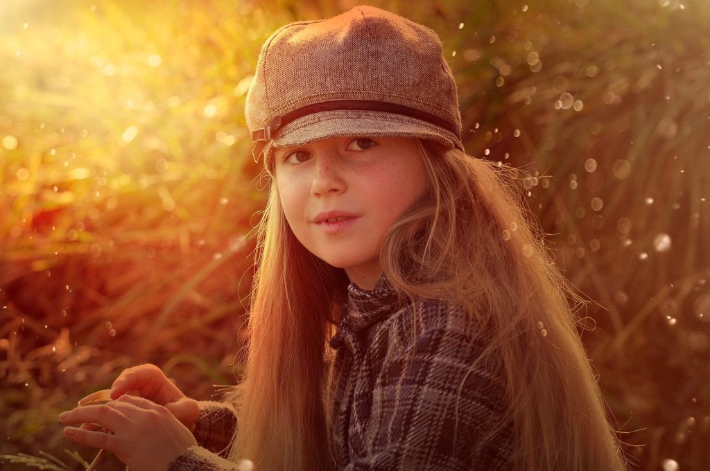 Child girl wearing a cap