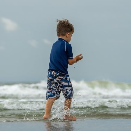 Boy playing on beach