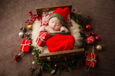 New born baby in red costume