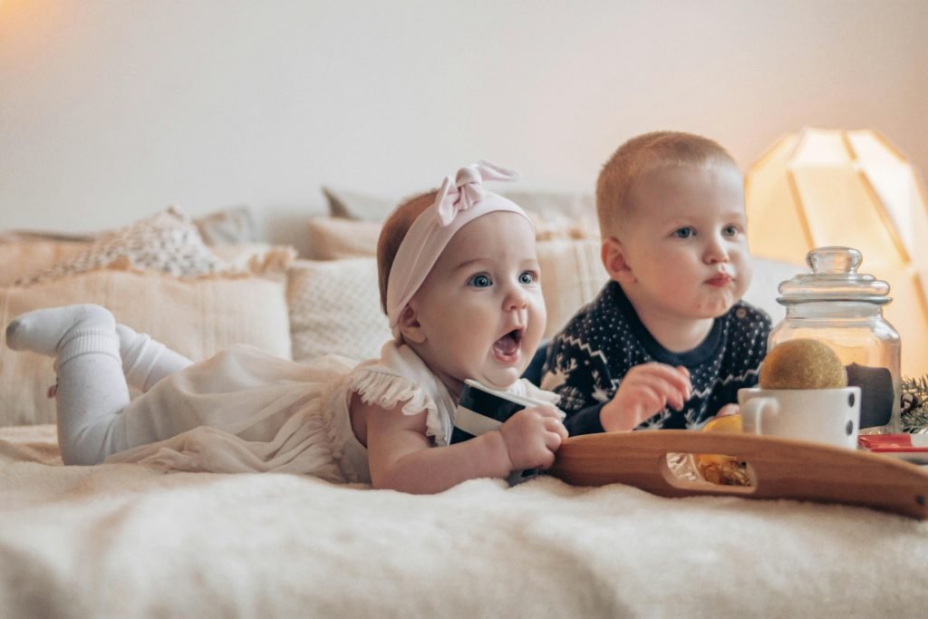 182 Modern Girl Names That Are Perfectly On-Trend 7 Children lying on bed at home and looking away