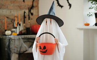 Child in a Ghost Costume - Featured