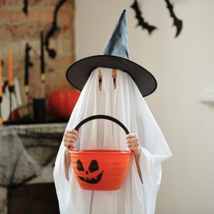 Child in a Ghost Costume - Featured