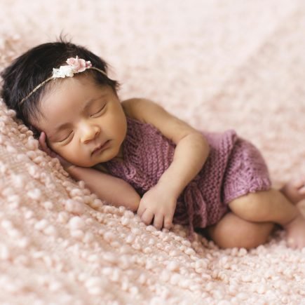 Toddler Lying on Pink Fleece Pad - Featured