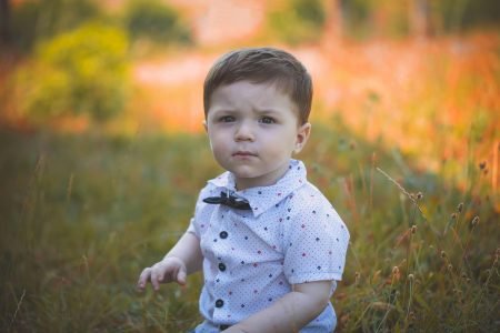 Toddler Wearing White Polo Shirt - Featured