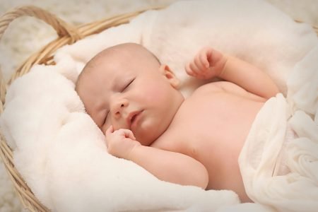 Baby Sleeping on White Cotton - Featured