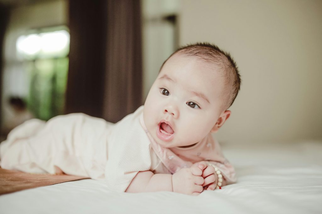Baby Lying on the Bed