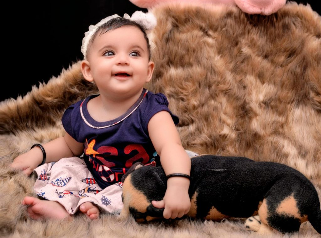 Baby Girl on a Fur Carpet