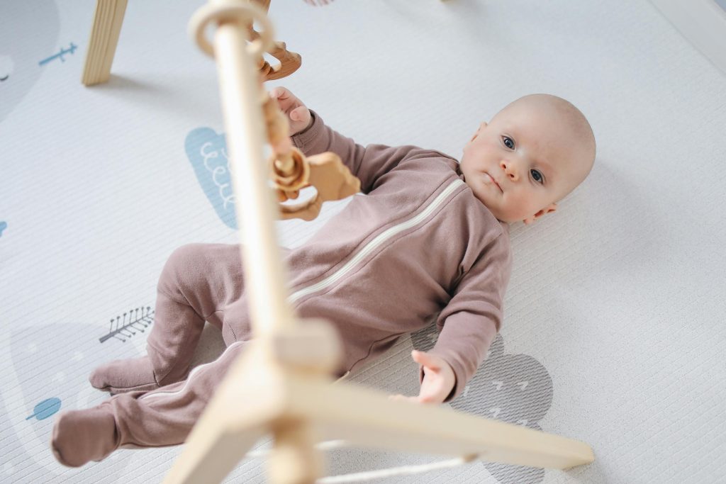 Baby Lying On Bed