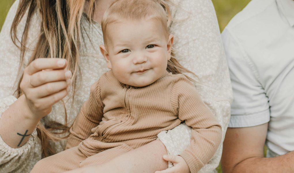 Heartwarming Family Moment Captured Outdoors - Featured