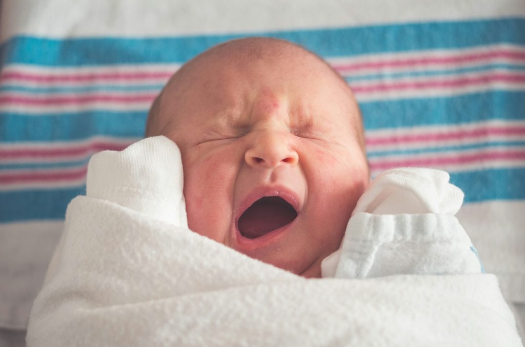 Yawning Newborn Baby Girl