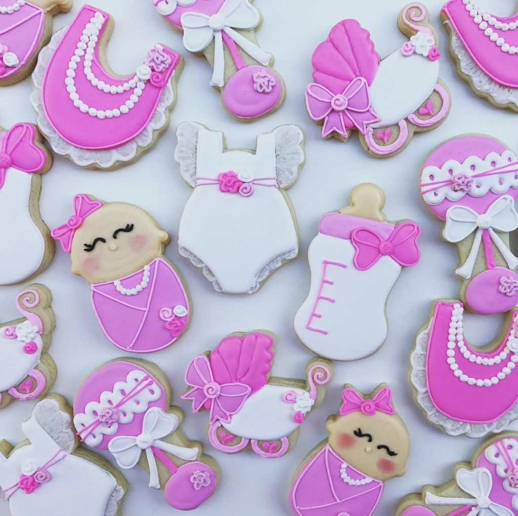 25 Baby Shower Cookie Ideas for Girls That Are Too Pretty to Eat 31 Classic Pink Baby Essentials Cookies