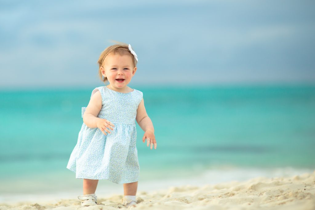 happy girl standing on beach