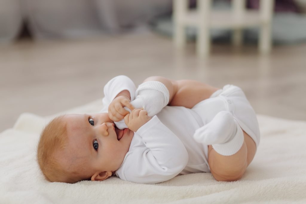 100 Modern Boy Names With Cool Nicknames 6 Young boy lying